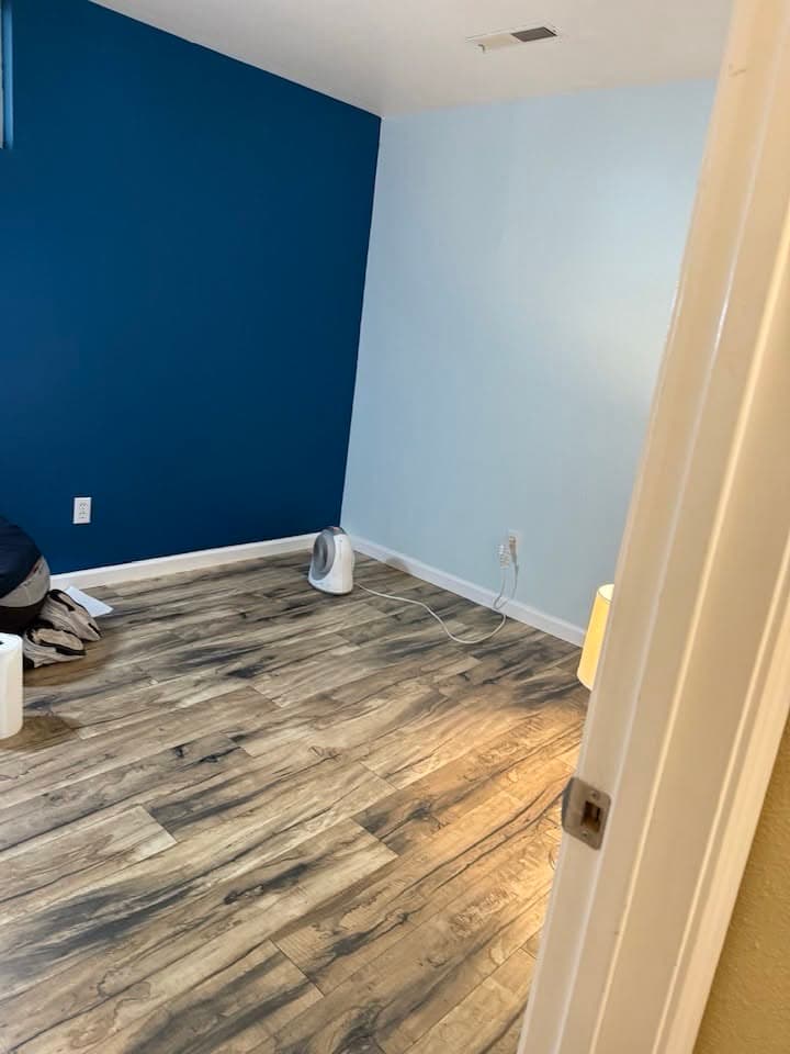Interior accent wall and trim painted by Best Pro Contractors
