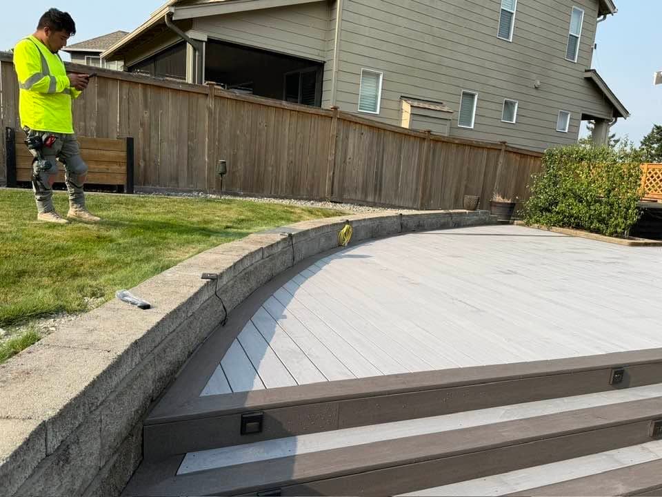A Best Pro Contractors crew member on site during a composite deck build in western Washington