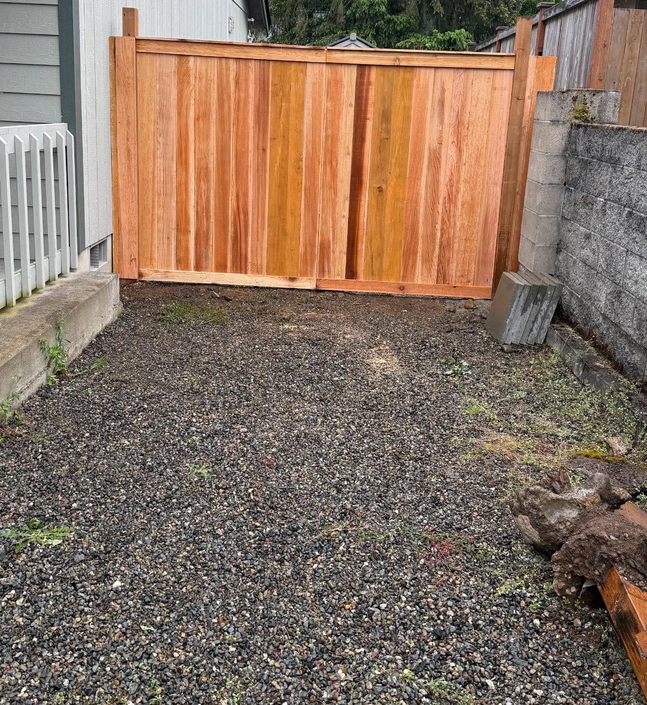 Cedar privacy fence with a braced double gate, built by Best Pro Contractors